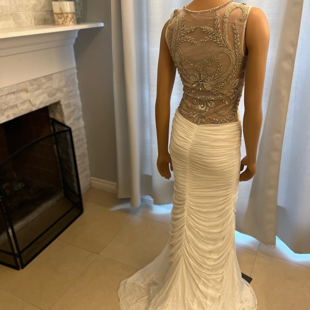 New Jovani very fitted with a showstopper back